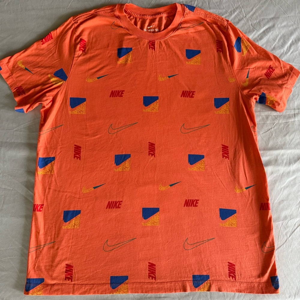 Nike Men's Vibrant Orange Tee with Blue and Yellow Retro Accents